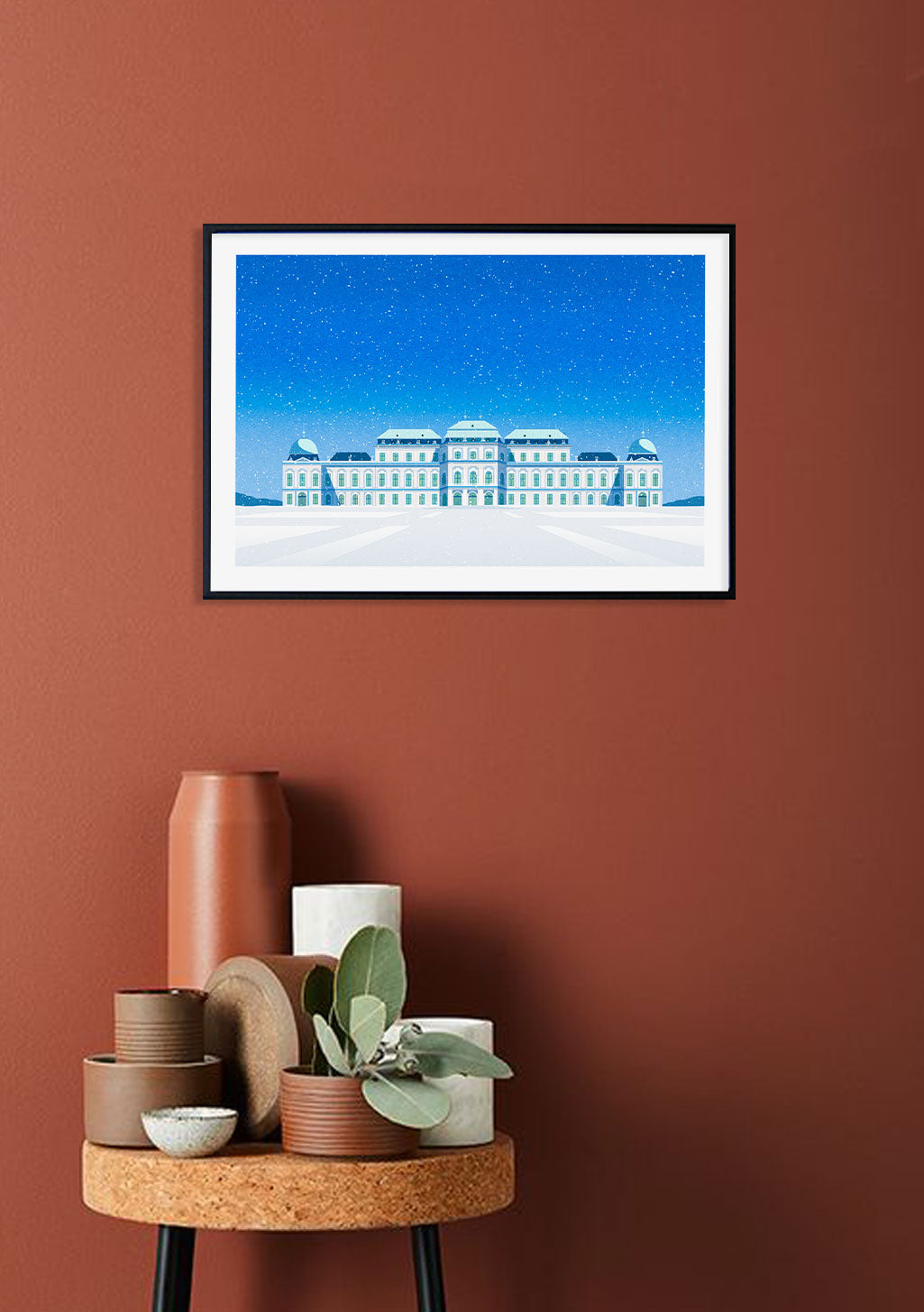 Bâtiment enneigé, ciel bleu, étoiles, cadre noir