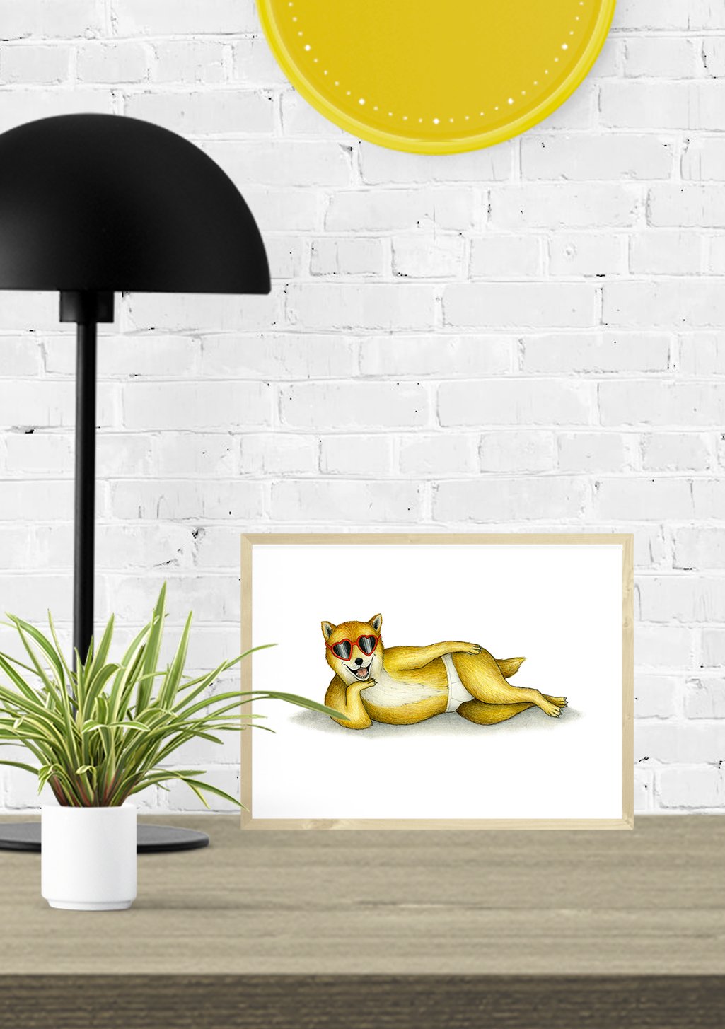 Chiot marron avec lunettes de soleil, allongé, cadre blanc