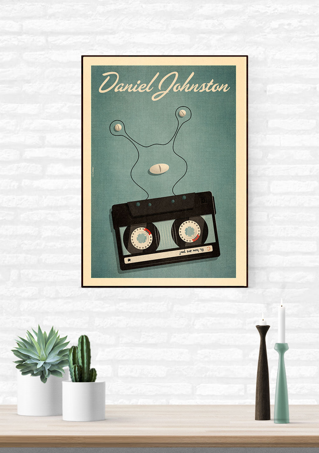 Poster de Daniel Johnston avec cassette et écouteurs