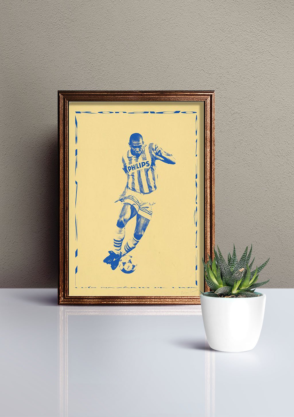 Poster encadré d'un joueur de football bleu et blanc